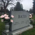 Artificial roses at the Bates family plot. Photo by Adrienne Hagen. Artificial roses