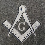 The "G" framed by a compass and square is the most recognizable symbol of the Freemasons. Photo by William Cronon