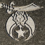 This is the emblem of the Ancient Arabic Order of the Nobles of the Mystic Shrine, more commonly known as 'Shriners'. Photo by William Cronon.