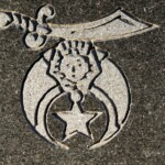 This is the emblem of the Ancient Arabic Order of the Nobles of the Mystic Shrine, more commonly known as 'Shriners'. Photo by William Cronon.