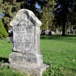 Severe weathering of unknown memorial, Section 26. Photo by Marisa Gomez.